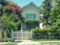 One Small cozy two-storey house with p trees