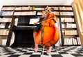 One small girl in uniform dress playing on cello Royalty Free Stock Photo