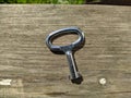 one small key on a wooden background top view photo Royalty Free Stock Photo