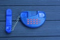 one small old blue plastic phone toy with red buttons Royalty Free Stock Photo