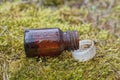 one small open glass brown medical bottle Royalty Free Stock Photo