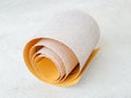 One small roll of extra coarse aluminum oxide sandpaper. Abrasive paper for dry sanding. Processing wood and metals, furniture Royalty Free Stock Photo