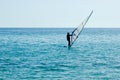 One small sailboat on open sea