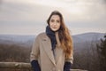 one smirking Caucasian girl outdoors portrait.