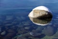 One snow covered boulder in the clean clear waters of Lake Tahoe