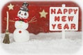 One snowman and a signpost with the words Happy New Year