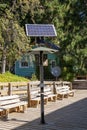 One solar panel in a pole near a modern house in the middle of a forest in Isla Victoria Royalty Free Stock Photo