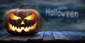 One spooky halloween pumpkin, Jack O Lantern, with an evil face and eyes on a wooden bench. Royalty Free Stock Photo