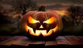 One spooky halloween pumpkin, Jack O Lantern, with an evil face and eyes on a wooden bench. Royalty Free Stock Photo