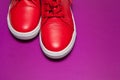 One sport red sneakers on purple background Royalty Free Stock Photo