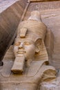 One of the statues of Ramses II at the magnificent ruins of the Great Temple of Ramses II at Abu Simbel in Egypt. Royalty Free Stock Photo