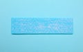 One stick of chewing gum on turquoise background, top view Royalty Free Stock Photo
