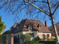 one-story house with a brown roof with a green track with a reduced real grass lawn Royalty Free Stock Photo