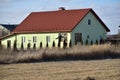 One-story house and a scarecrow in the garden Royalty Free Stock Photo