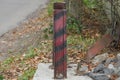 One striped iron fence post from an old rail Royalty Free Stock Photo