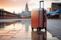 One suitcase stands on the road near the hotel. Vacation, travel concept.