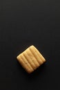 One sweet and salted Cumin cookie or Indian Jeera cookie, on a black background. Royalty Free Stock Photo