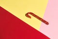 One sweet stick isolated on the red, yellow and pink background
