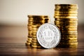 One swiss frank coin and gold money on the desk