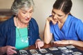 This one takes me back...a resident and a nurse looking through a photo album. Royalty Free Stock Photo