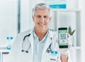 one tap is all it takes. a male doctor holding a smartphone depicting a QR code to be scanned.