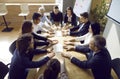 Multiracial team of business people having a work meeting around an office table Royalty Free Stock Photo