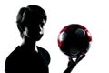 One teenager boy girl silhouette holding showing soccer footba Royalty Free Stock Photo
