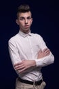 One teenager boy portrait, standing, arms crossed, white shirt, Royalty Free Stock Photo