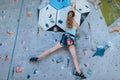 One teenager climbing a rock wall indoor. Royalty Free Stock Photo