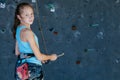 One teenager climbing a rock wall indoor. Royalty Free Stock Photo