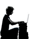 One teenager silhouette computer computing lap Royalty Free Stock Photo