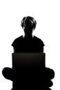 One teenager silhouette computer computing lap Royalty Free Stock Photo