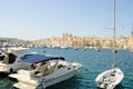 Senglea, Malta, August 2019. Boats in the bay and city view.