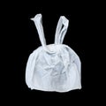 one tied white plastic bag isolated on black