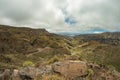 One of the tight turns of a narrow rural road in the mountains of Parque Natural Majona. View of the gorge and San Sebastian, the