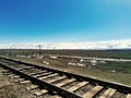 One track rail road stretching along the Tyan Shan mountain range Royalty Free Stock Photo