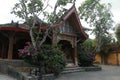 One of the traditional houses that is still preserved in the village. Traditional wooden house in a tropical garden on Lombok