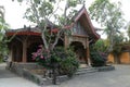 One of the traditional houses that is still preserved in the village. Traditional wooden house in a tropical garden on Lombok