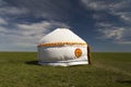 Russia. One traditional Kalmyk or Mongol yurts in a green spring steppe under the blue sky