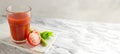 One transparent glass cup with red tomato juice and a sprig of celery on a light background. Healthy food concept. Royalty Free Stock Photo