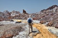 One traveler follows the path of a salt stream, Iran. Royalty Free Stock Photo