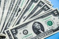 One and two dollar bills on a blue background.financial and economic concept Royalty Free Stock Photo