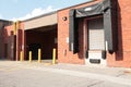 one two receiving bay garage doors next to each other in bright sun in summer. p Royalty Free Stock Photo