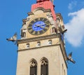 One of two towers of the City Church of Winterthur against blue