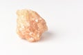 One uncut and rough Sunstone crystal,quartz on white