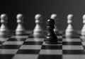 One unique pawn outstanding from many opposits. Concept of individual, different, standout. Black and white Royalty Free Stock Photo