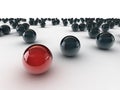 One unique red ball, among other black Royalty Free Stock Photo