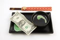 One United States dollar bill on a sushi plate Royalty Free Stock Photo