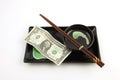 One United States dollar bill on a sushi plate Royalty Free Stock Photo