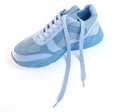 One unlaced light blue sneaker on a white background. Sports shoes Royalty Free Stock Photo